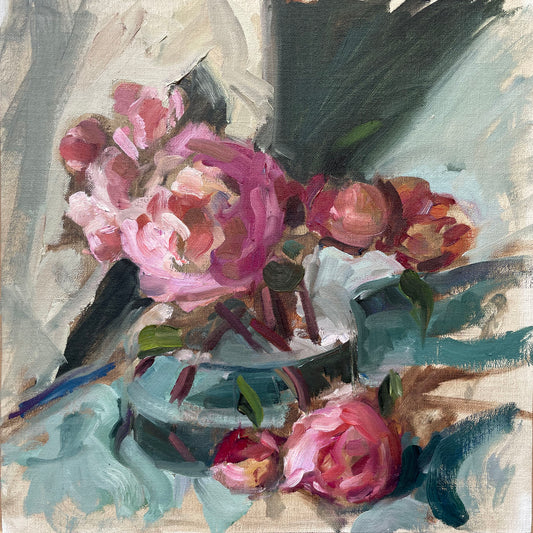 Fading peonies in a glass vase